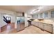 Well-lit kitchen featuring stainless steel appliances, tile floor, and generous counter space at 203 Cedar Creek Ct, Acworth, GA 30101