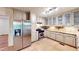Well-lit kitchen featuring stainless steel appliances, tile floor, and generous counter space at 203 Cedar Creek Ct, Acworth, GA 30101