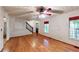 Spacious living room with hardwood floors, staircase, and natural light from windows at 203 Cedar Creek Ct, Acworth, GA 30101