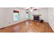 Bright living room features a stone fireplace, hardwood floors, and plentiful natural light at 203 Cedar Creek Ct, Acworth, GA 30101