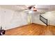 Open living space with hardwood floors, adjacent hallway and staircase at 203 Cedar Creek Ct, Acworth, GA 30101