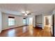 Large main bedroom with wood floors, windows, and access to an en suite bathroom and closet at 203 Cedar Creek Ct, Acworth, GA 30101