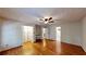 Large main bedroom with wood floors, a built-in desk area, closet, and access to an en suite bathroom at 203 Cedar Creek Ct, Acworth, GA 30101