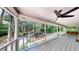 Enjoy the beauty of the outdoors from this covered porch with ceiling fan and bench swing at 203 Cedar Creek Ct, Acworth, GA 30101