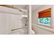 Updated bathroom features a tiled shower with glass doors and custom fixtures at 203 Cedar Creek Ct, Acworth, GA 30101
