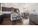 Modern kitchen with stainless steel appliances, granite countertops, island and adjacent dining area at 3415 Linstead Ct, Loganville, GA 30052