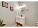 Bathroom with a single sink vanity, storage space, and neutral paint at 615 Willowbrook Run, Johns Creek, GA 30022