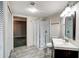 Bathroom features a glass enclosed shower, updated vanity and tile floors at 615 Willowbrook Run, Johns Creek, GA 30022