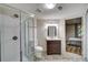 Updated bathroom with glass-enclosed shower and modern vanity at 615 Willowbrook Run, Johns Creek, GA 30022