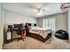 Cozy bedroom with natural light, desk setup, and space for relaxation at 615 Willowbrook Run, Johns Creek, GA 30022