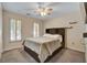 Bedroom with natural light, ceiling fan, and carpet floors at 615 Willowbrook Run, Johns Creek, GA 30022
