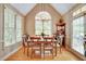 Dining room with plenty of light, hardwood floors and neutral paint at 615 Willowbrook Run, Johns Creek, GA 30022