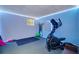 Well-lit exercise room with an elliptical machine and space for workout equipment at 615 Willowbrook Run, Johns Creek, GA 30022