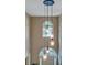 Bright two-story foyer with decorative pendant lighting and arched windows at 615 Willowbrook Run, Johns Creek, GA 30022