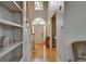 Inviting hallway with built-in shelving and natural light at 615 Willowbrook Run, Johns Creek, GA 30022