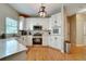Kitchen with modern appliances, quartz countertops, and hardwood floors at 615 Willowbrook Run, Johns Creek, GA 30022