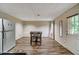 Bright kitchen with wood floors, dining table and stainless steel refrigerator at 615 Willowbrook Run, Johns Creek, GA 30022