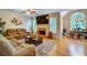 Open living room with fireplace and large windows for ample natural light at 615 Willowbrook Run, Johns Creek, GA 30022