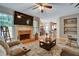 Cozy living room featuring a fireplace and an open layout at 615 Willowbrook Run, Johns Creek, GA 30022