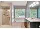 Serene bathroom with a separate shower, soaking tub, and double vanity sinks at 615 Willowbrook Run, Johns Creek, GA 30022