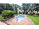 Backyard view featuring an in-ground swimming pool, patio and mature trees at 75 Maygold St, Mcdonough, GA 30253