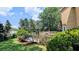 Scenic backyard featuring a wooden deck and swimming pool surrounded by mature trees and lush greenery at 75 Maygold St, Mcdonough, GA 30253