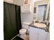 Bathroom featuring a combination shower and tub with patterned tile and a single vanity at 75 Maygold St, Mcdonough, GA 30253