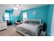 Bright bedroom featuring a ceiling fan, chair, and a comfortable bed with built-in shelves at 75 Maygold St, Mcdonough, GA 30253