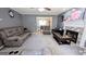 Cozy living room with gray walls, fireplace, and comfortable seating arrangement at 75 Maygold St, Mcdonough, GA 30253