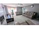 Spacious living room featuring neutral carpet, a fireplace, and large windows for natural light at 75 Maygold St, Mcdonough, GA 30253
