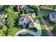 Beautiful home with green lawn, manicured landscaping and an inviting circular driveway at 8455 Abingdon Ln, Duluth, GA 30097