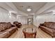 Spacious finished basement area featuring hardwood floors, recessed lighting and comfortable seating at 8455 Abingdon Ln, Duluth, GA 30097