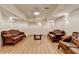Spacious basement with hardwood floors and comfortable seating, great for relaxing or entertaining at 8455 Abingdon Ln, Duluth, GA 30097