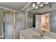 Bathroom with gold-framed shower, neutral color palette, and bright vanity lighting at 8455 Abingdon Ln, Duluth, GA 30097