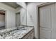 Bathroom with granite counters, modern sinks, and an oversized mirror enhances the spa-like feel at 8455 Abingdon Ln, Duluth, GA 30097