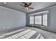 Cozy bedroom with a window seat and decorative shutters complemented by plush carpeting at 8455 Abingdon Ln, Duluth, GA 30097