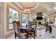 Charming breakfast area with backyard view, open to living space with stone fireplace at 8455 Abingdon Ln, Duluth, GA 30097