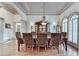 Spacious dining room with hardwood floors, decorative molding, and ample natural light at 8455 Abingdon Ln, Duluth, GA 30097