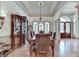 Spacious dining room with hardwood floors, decorative molding, and ample natural light at 8455 Abingdon Ln, Duluth, GA 30097
