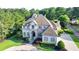 Elegant home with manicured lawn and mature trees, offering curb appeal and privacy at 8455 Abingdon Ln, Duluth, GA 30097