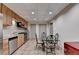 Kitchen with stainless steel appliances, stone countertops, and tiled floor at 8455 Abingdon Ln, Duluth, GA 30097