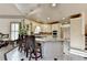 Bright eat-in kitchen with stainless steel appliances, tile floors, granite counters, and a breakfast bar at 8455 Abingdon Ln, Duluth, GA 30097