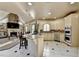 Bright eat-in kitchen with stainless steel appliances, tile floors, granite counters, and a breakfast bar at 8455 Abingdon Ln, Duluth, GA 30097