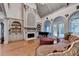 Living room featuring fireplace, large windows and a grand piano at 8455 Abingdon Ln, Duluth, GA 30097
