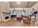 Elegant living room featuring large windows, a fireplace, and a grand piano at 8455 Abingdon Ln, Duluth, GA 30097