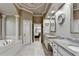 This main bathroom features a large bathtub, double sinks, and access to a bedroom at 8455 Abingdon Ln, Duluth, GA 30097