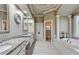 This main bathroom features a large bathtub, double sinks, and a separate shower stall at 8455 Abingdon Ln, Duluth, GA 30097