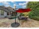 Beautiful patio with outdoor dining area, perfect for enjoying the pool and landscaped backyard at 8455 Abingdon Ln, Duluth, GA 30097