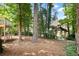 Beautiful backyard features a charming gazebo, surrounded by lush greenery and mature trees at 1111 Waterford Green Pt, Marietta, GA 30068