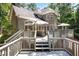 Beautiful backyard with a spacious deck, lush greenery, and ample space for outdoor entertaining at 1111 Waterford Green Pt, Marietta, GA 30068